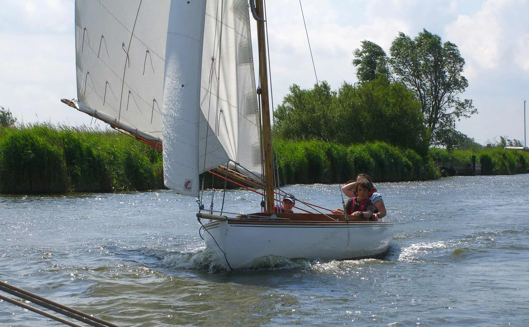 Half-decker sailing the Norfolk Broads.