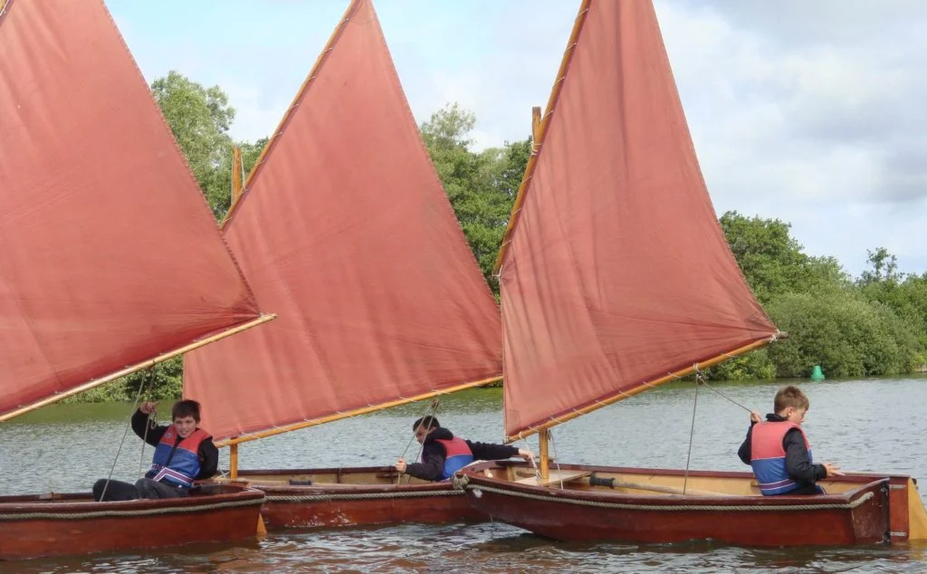 Youth Sailing dinghies on the Norfolk Broads.